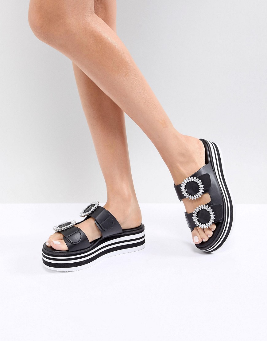 Imagen principal de producto de Zapatos con plataforma plana sin cordones en dos partes con detalle de hebilla adornada de ALDO - ALDO