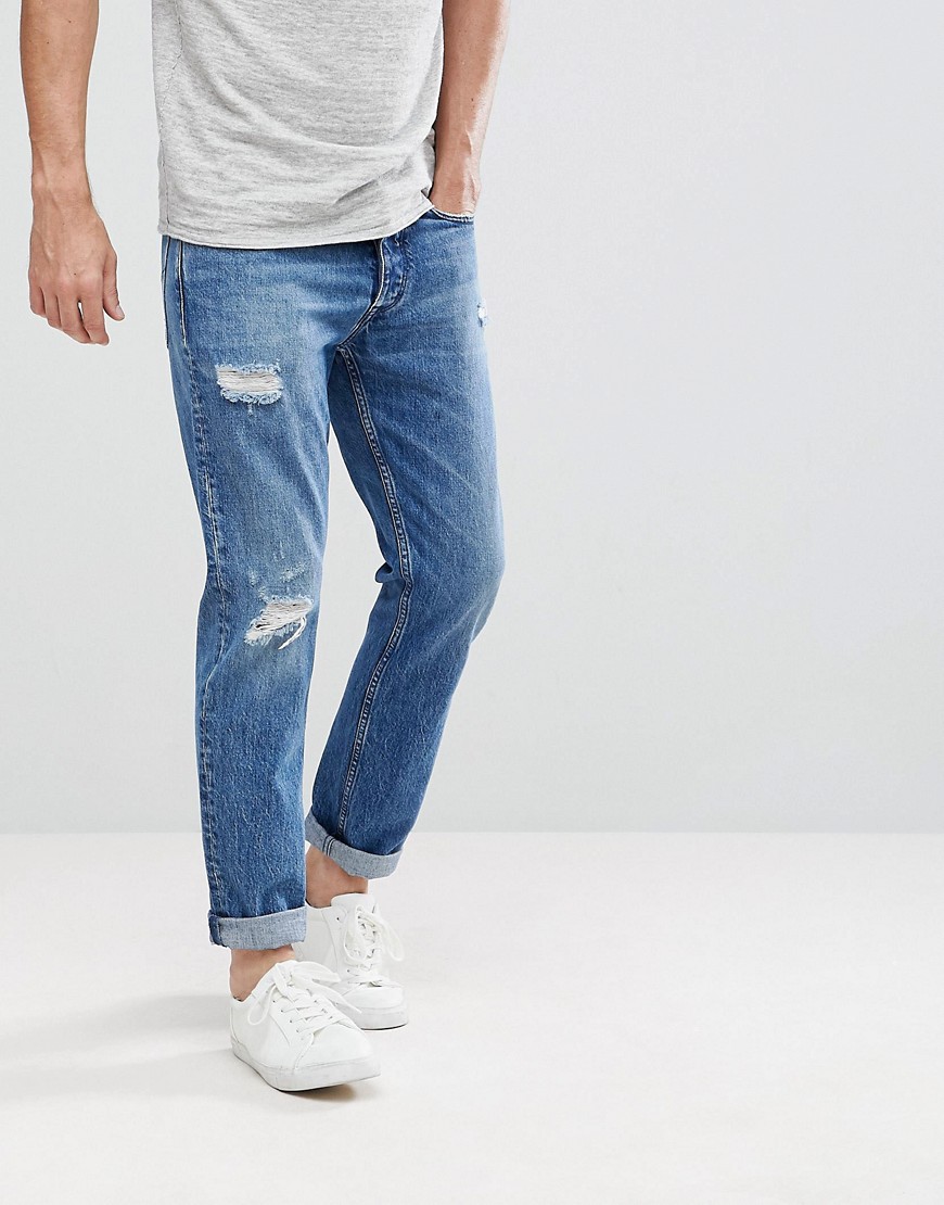 Суженные книзу джинсы с рваной отделкой Calvin Klein - Синий