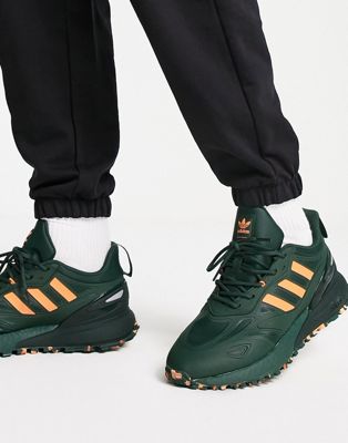 1K Boost trainers in green and orange