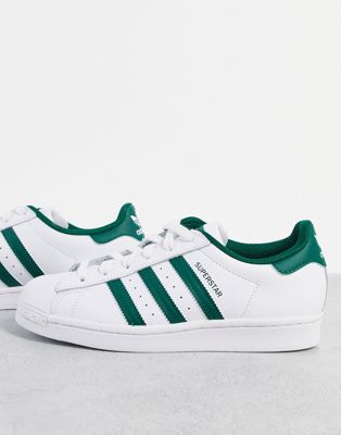 Superstar trainers in white with collegiate green stripes