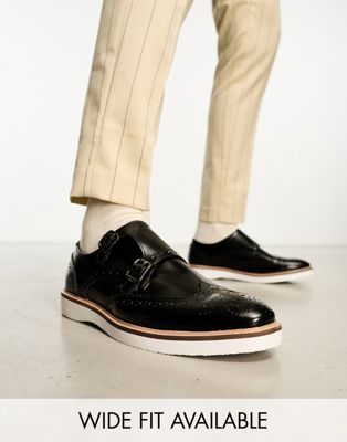 brogue monk shoes in black leather with white wedge sole