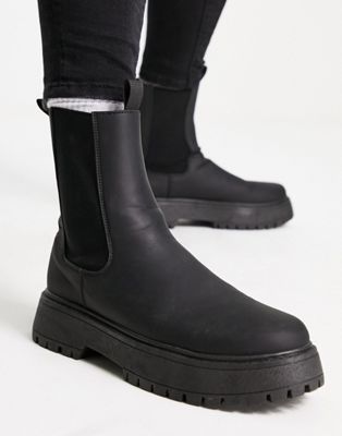 chelsea calf boots with chunky sole in black faux leather