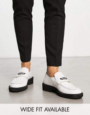 chunky loafers in white leather with black hardware and contrast sole