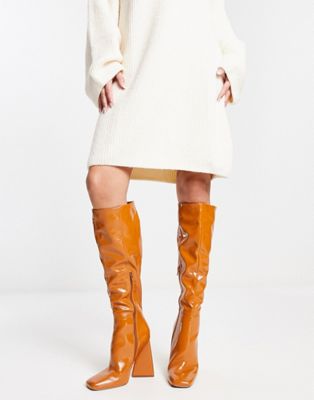Clara high-heeled knee boots in mustard patent