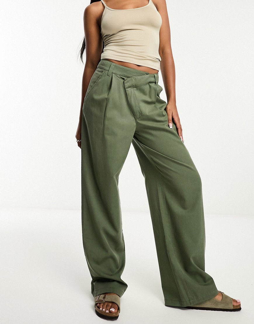 ASOS DESIGN dad trouser with asymmetric waist in khaki-Green