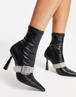 Excuse high-heeled boots with embellished buckle in black