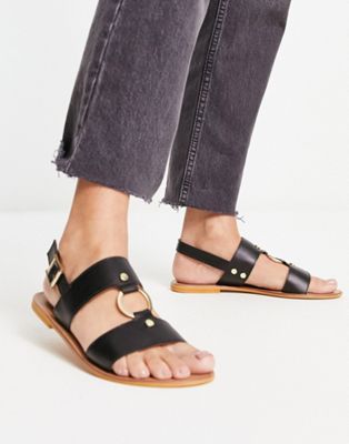 Fancy leather ring and stud detail flat sandal in black