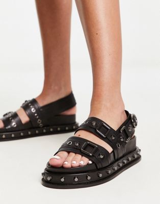 Focused leather studded flat sandals in black