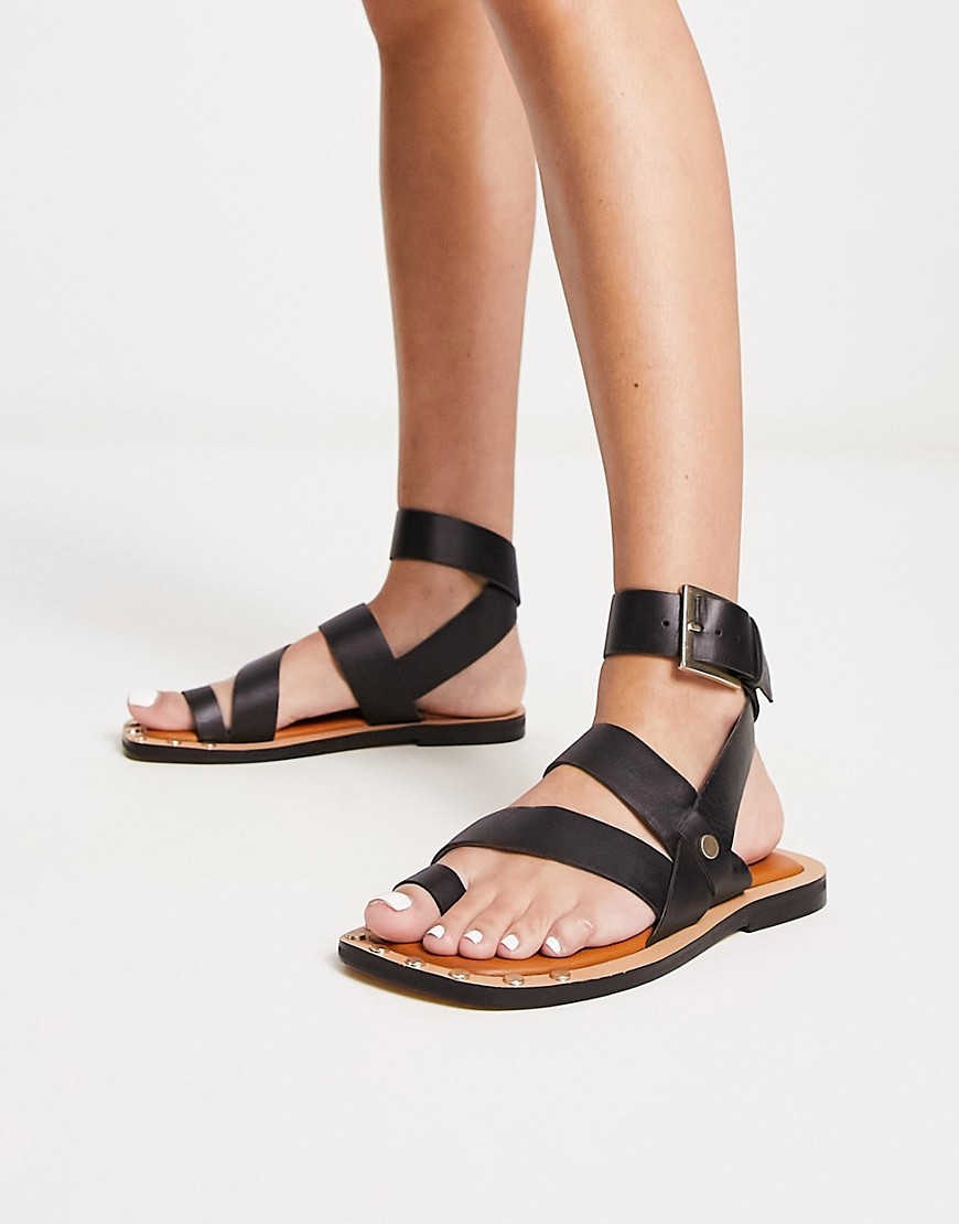 ASOS DESIGN Foxy leather studded toe loop flat sandals in black