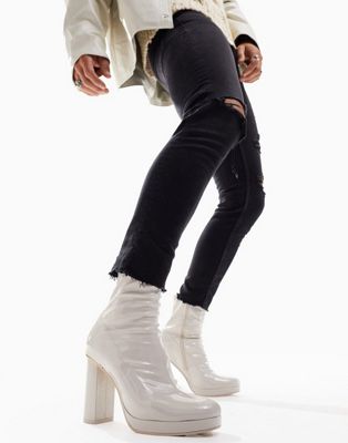 heeled boot in cream patent faux leather