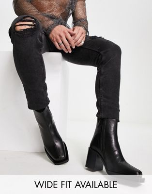 heeled chelsea boots with angled toe in black leather