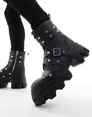 lace up boot with chunky sole and studded strapping in black faux leather