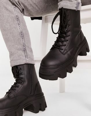 lace up calf boot with chunky sole in black faux leather