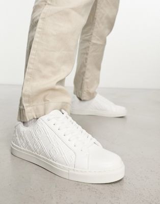 lace up trainers in white with embossed monogram