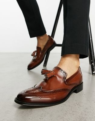 loafers with brogue detail in polished tan leather