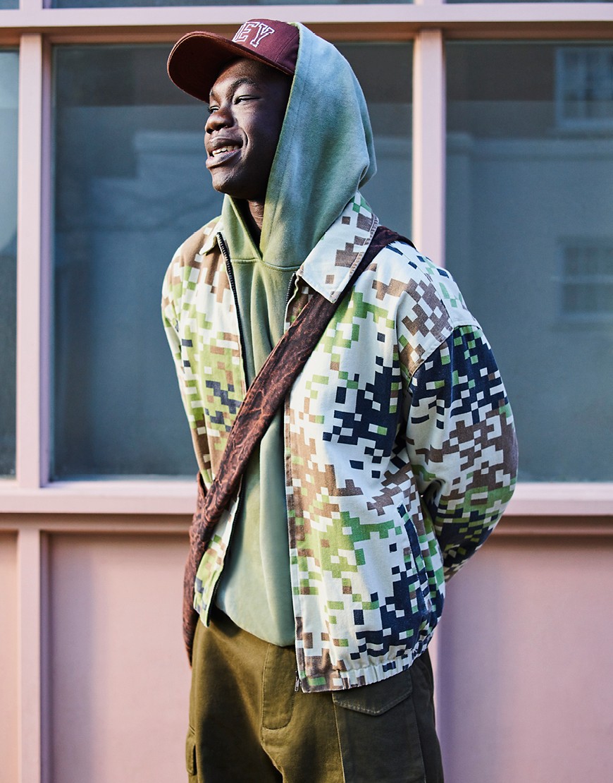 ASOS DESIGN oversized bomber jacket in glitch camo print in green