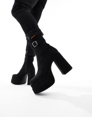 platform heeled boots in black faux suede with buckle detail