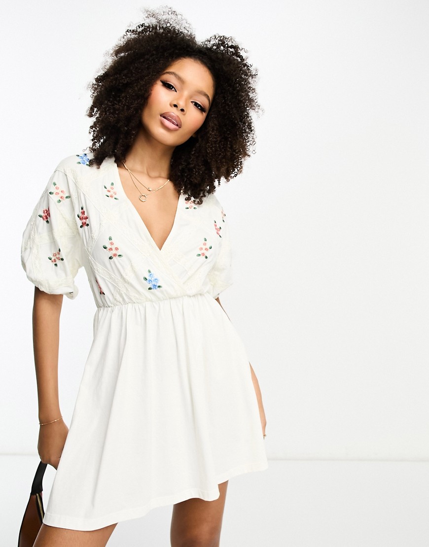 ASOS DESIGN smock mini dress with cross lace insert and embroidery in cream-White