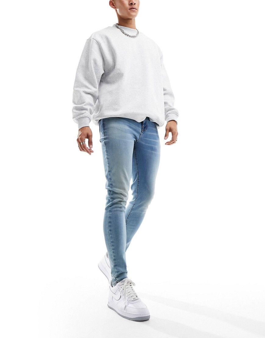 ASOS DESIGN spray on jeans with power stretch in tinted light blue