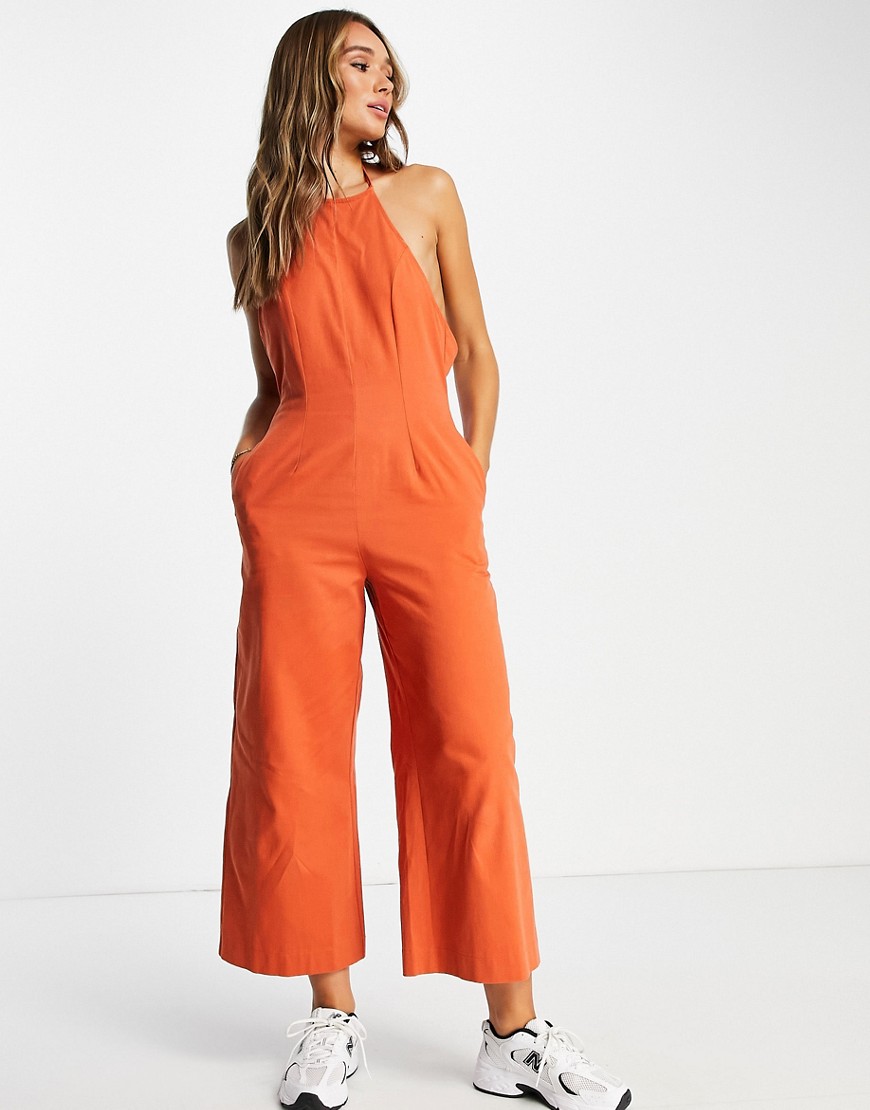 ASOS DESIGN twill strappy halter neck jumpsuit with wide leg in rust-Red