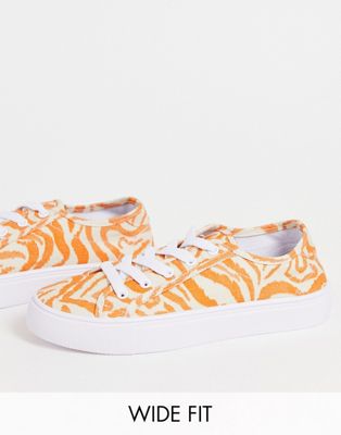Wide Fit Dizzy lace up trainers in tiger print