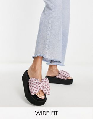 Wide Fit Teach bow flatform mules in pink