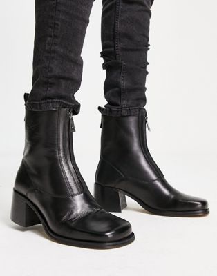 Monty zip front heeled boots in black leather