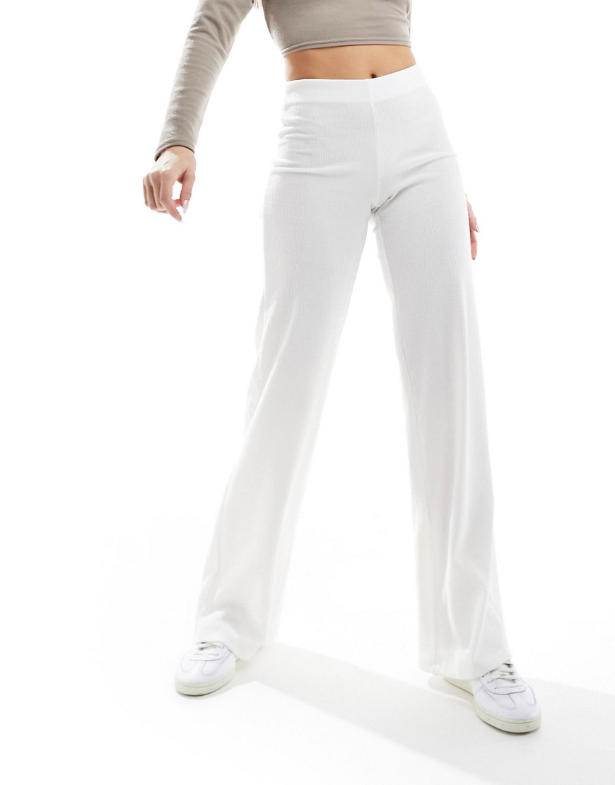 Bershka crinkle flared beach trousers in white