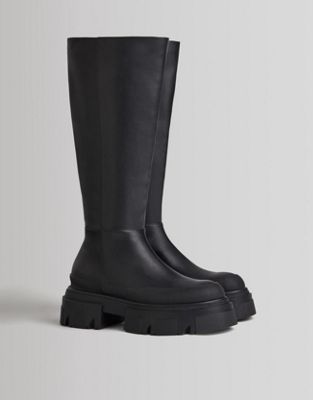 high leg boot with chunky sole in black