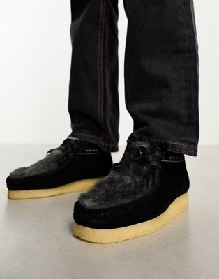 Wallabee boots in black faux fur