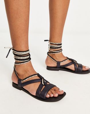 leather wrap sandal in black and cream