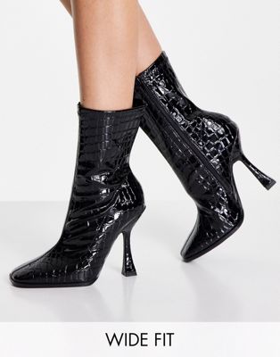 flare heel boot in black patent