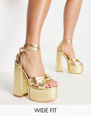 platform heel sandals in gold snake