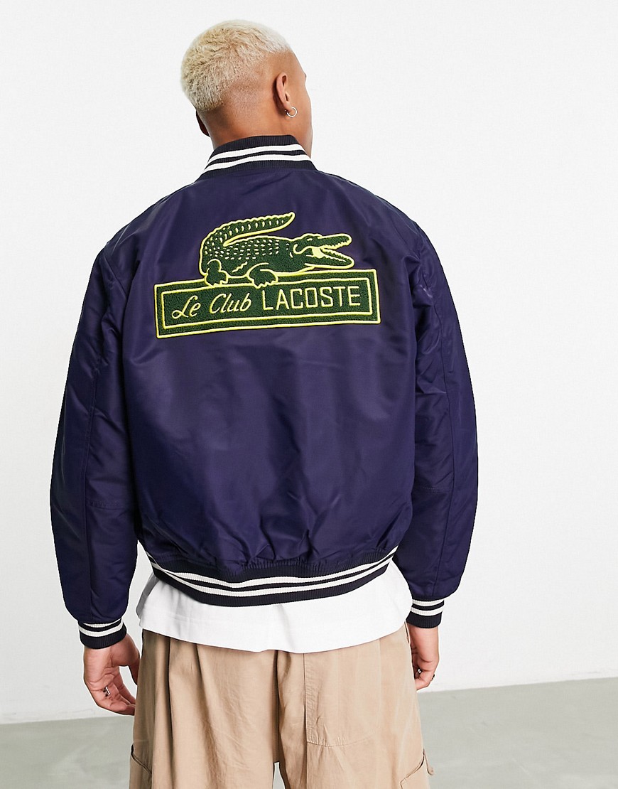 Lacoste varsity jacket in navy with patches and back print