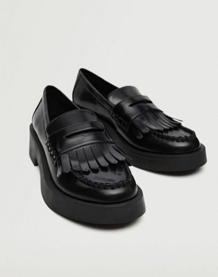 chunky patent loafers with fringe detail in black