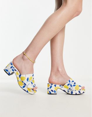 lemon print mid chunky heeled platform mules in yellow