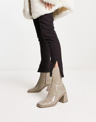 vegan patent heeled boot in taupe