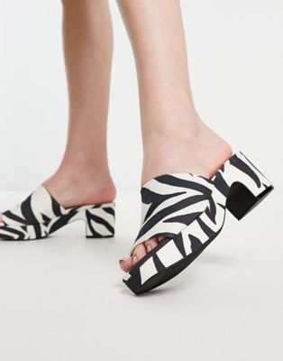 zebra print mid chunky heeled platform mules in black and white
