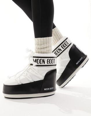 mid ankle snow boots in black and white