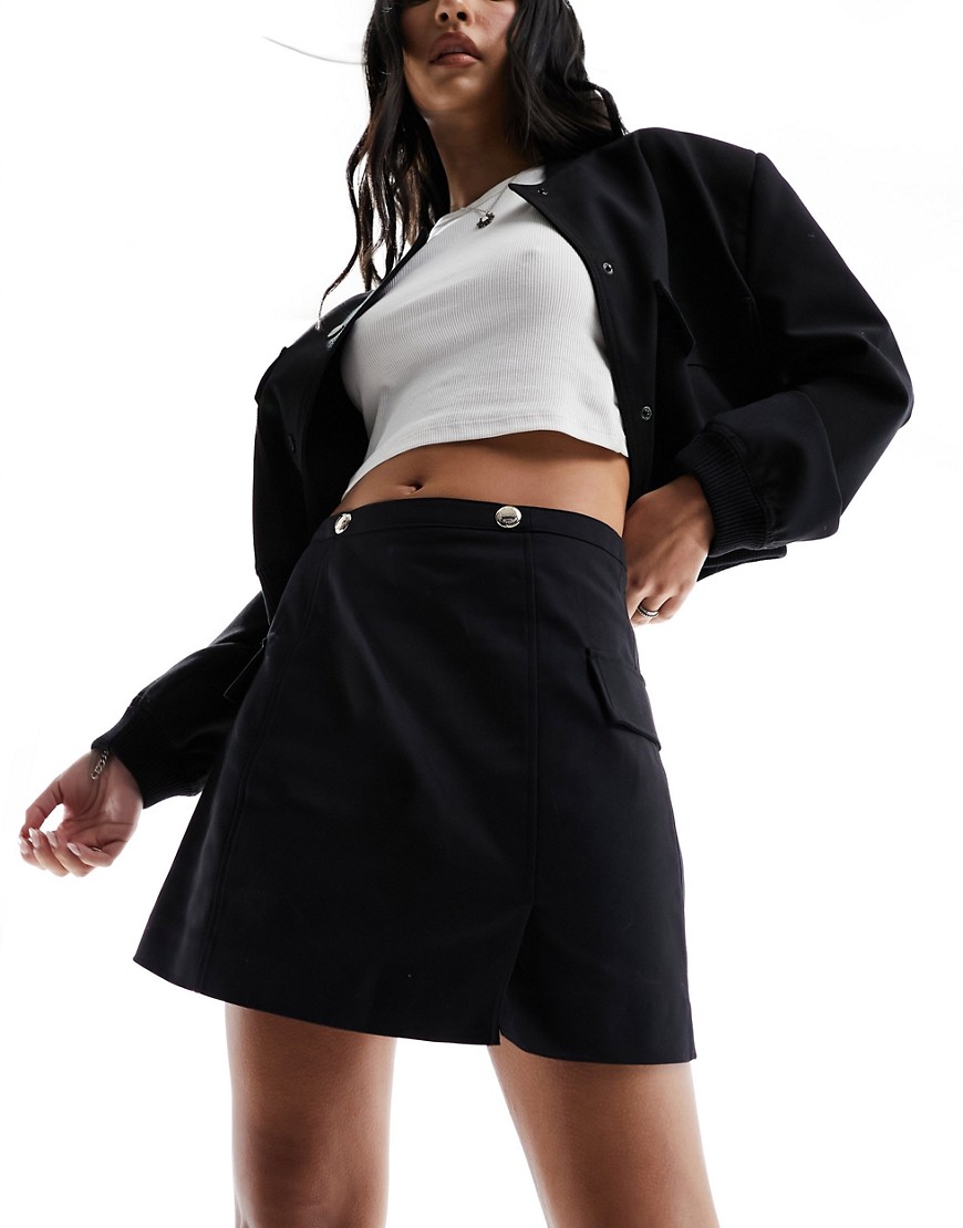 Morgan aline mini skirt with hardwear detail in black