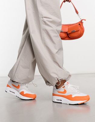 Air Max 1 trainers in grey and safety orange