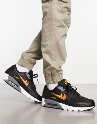 Air Max 90 double swoosh spray trainers in black and orange