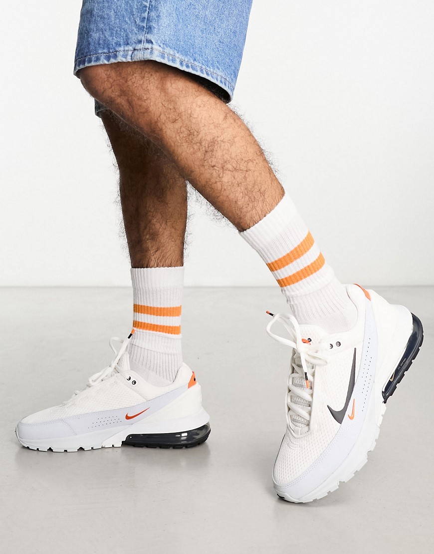 Nike Air Max Pulse trainers in white, black and orange