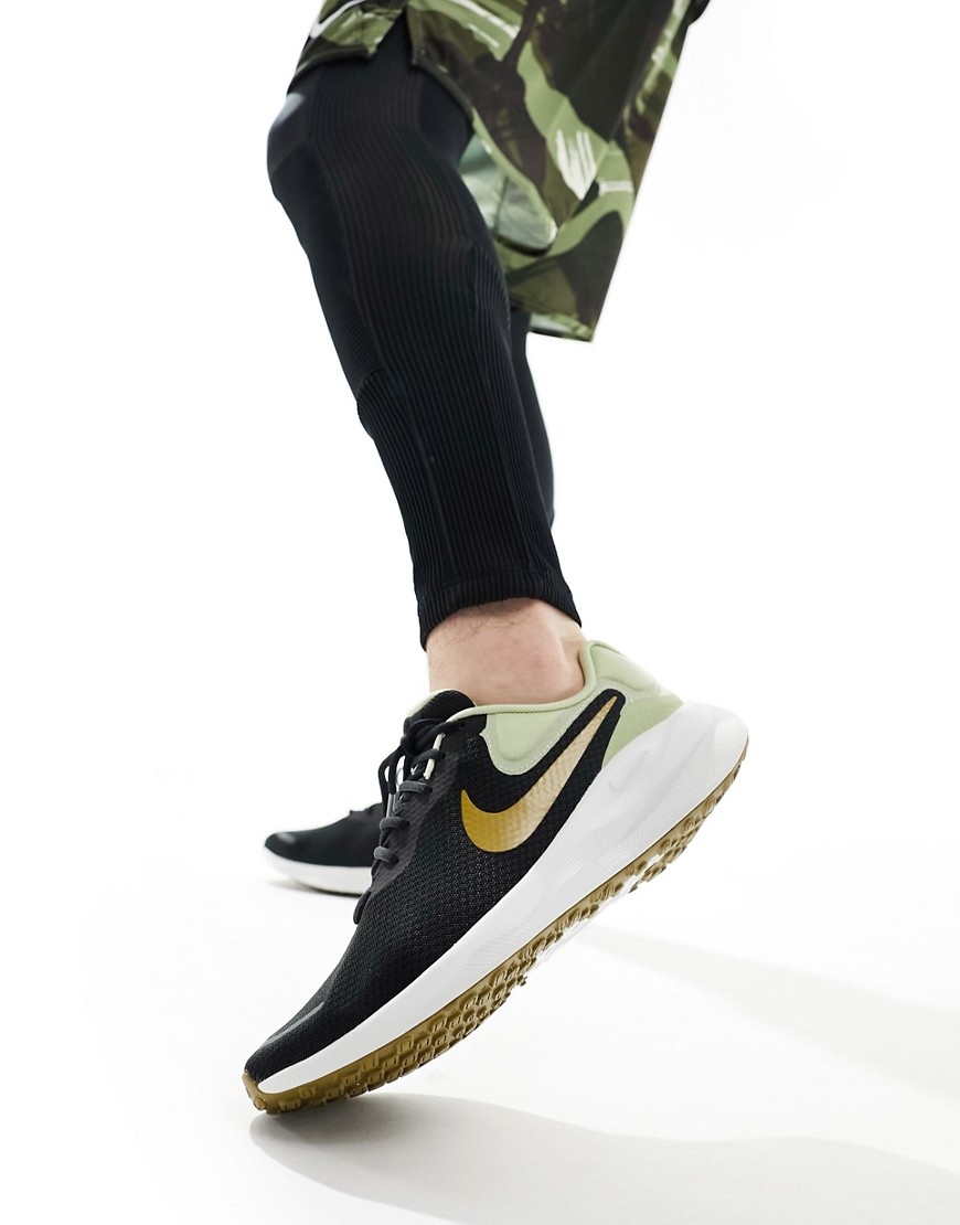 Nike Running Revolution 7 trainers in black and gold
