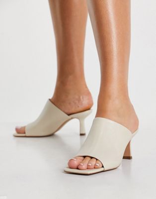 leather heeled mules in beige