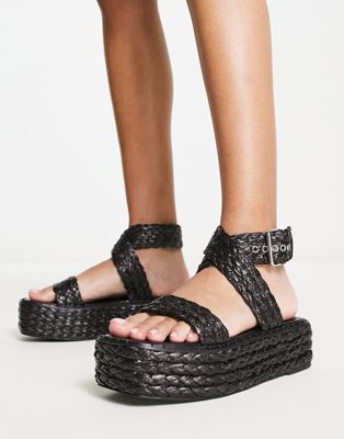Crystal flatform sandals in black raffia