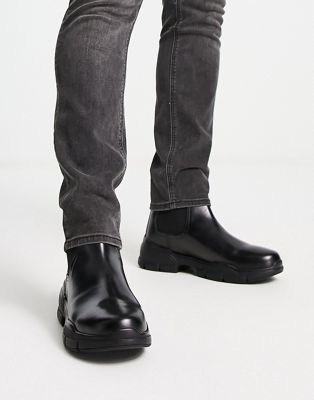 cleated sole chelsea rain boots in black leather
