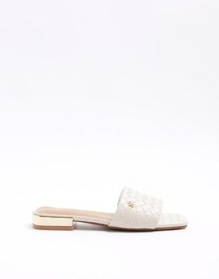 Woven flat sandals in cream