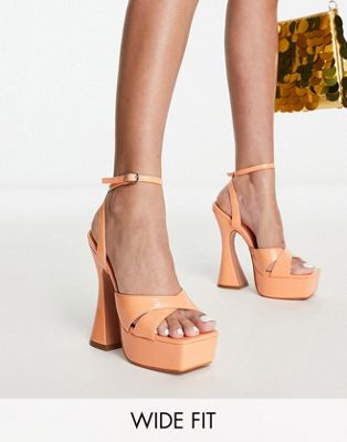 Simmi London Wide Fit Oceani platforms with flared heel in apricot patent-Orange