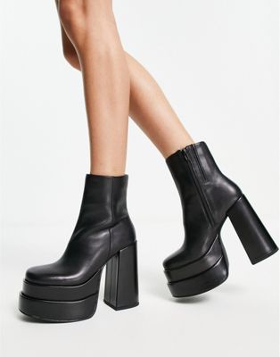 Cobra platform heeled boots in black leather